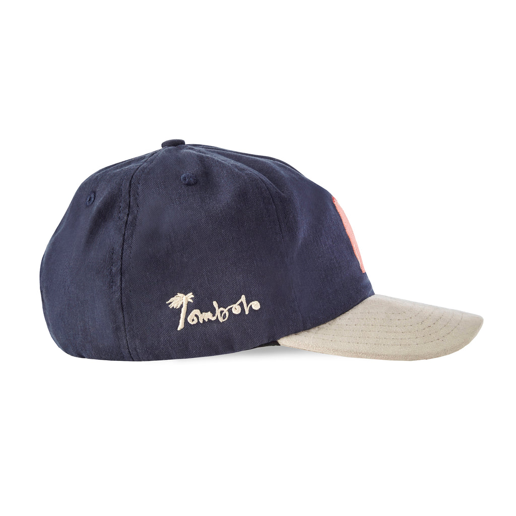 side view of navy cap with Tombolo embroidered