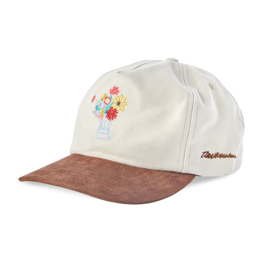 Side angle of cap with embroidered flowers