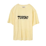 Yellow t-shirt with 'Turismo' embroidered text on a white background