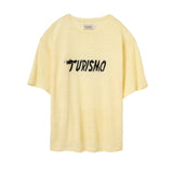Yellow t-shirt with 'Turismo' embroidered text on a white background
