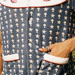 close up of shirt pattern with hand in pocket