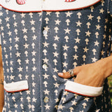 close up of shirt pattern with hand in pocket