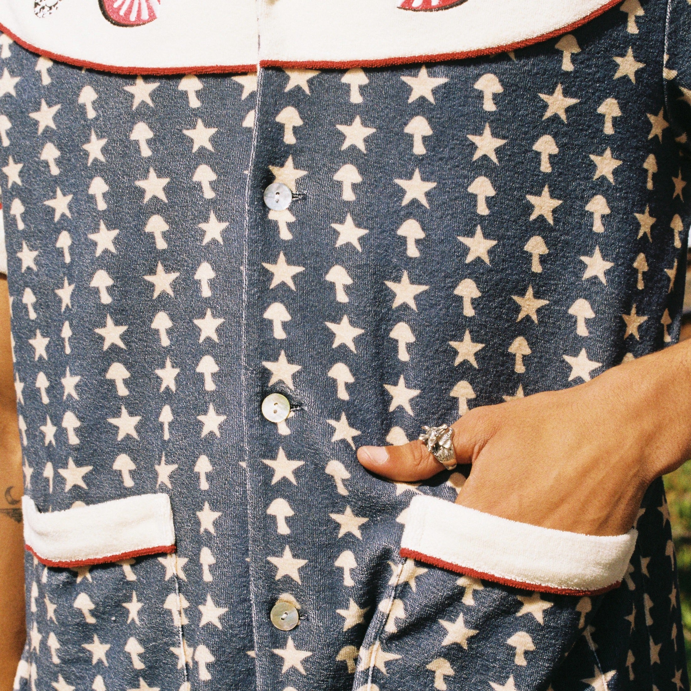 close up of shirt pattern with hand in pocket