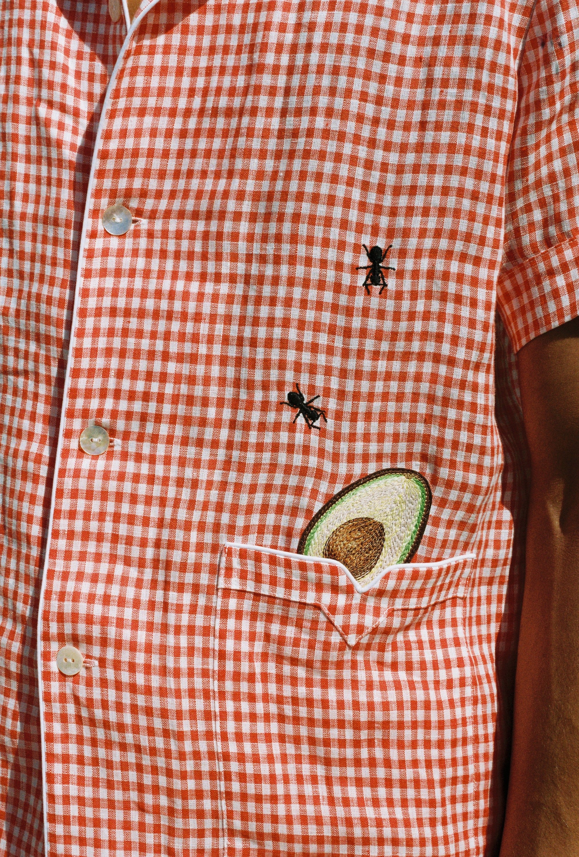 close up of shirt showing ants and avocado motif
