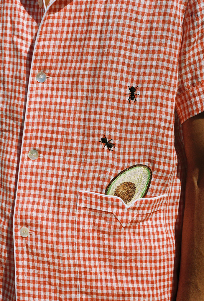close up of shirt showing ants and avocado motif