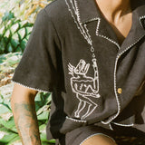 original artwork depicting a pre-Colombian figurine on a stylish cotton terry cloth shirt