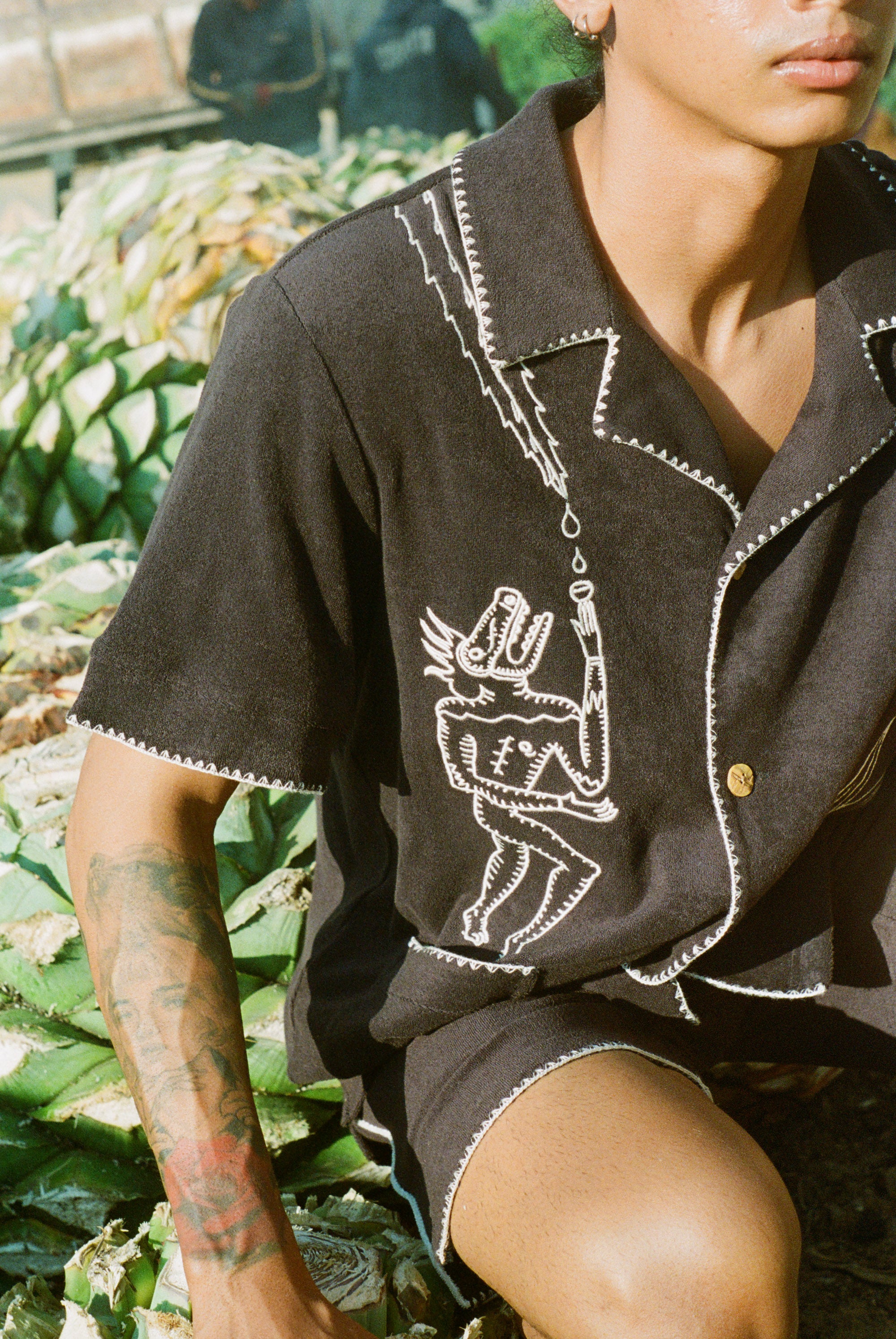 original artwork depicting a pre-Colombian figurine on a stylish cotton terry cloth shirt