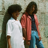 Female model in white cabrisa next to male model in valencia cabrisa