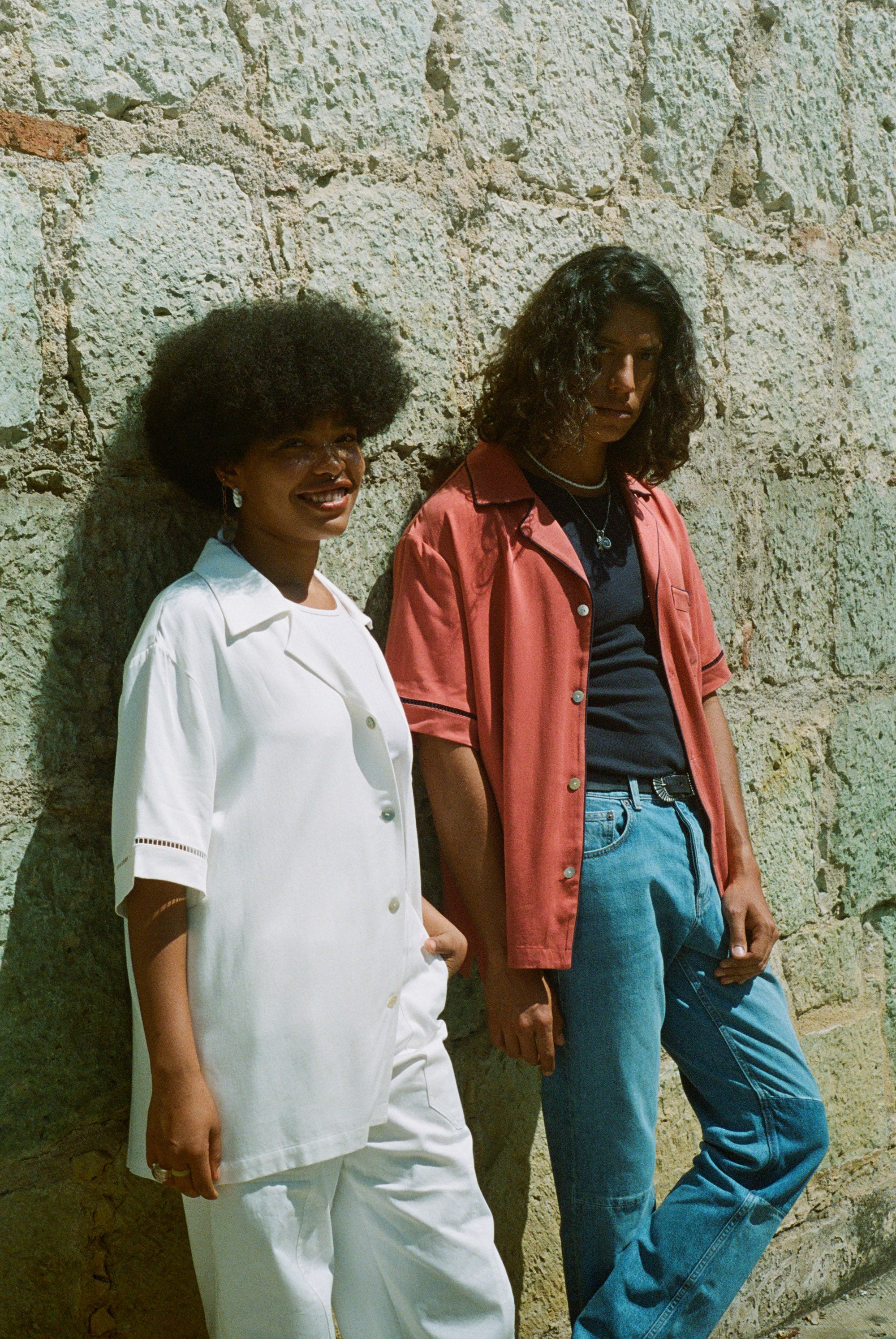 Female model in white cabrisa next to male model in valencia cabrisa