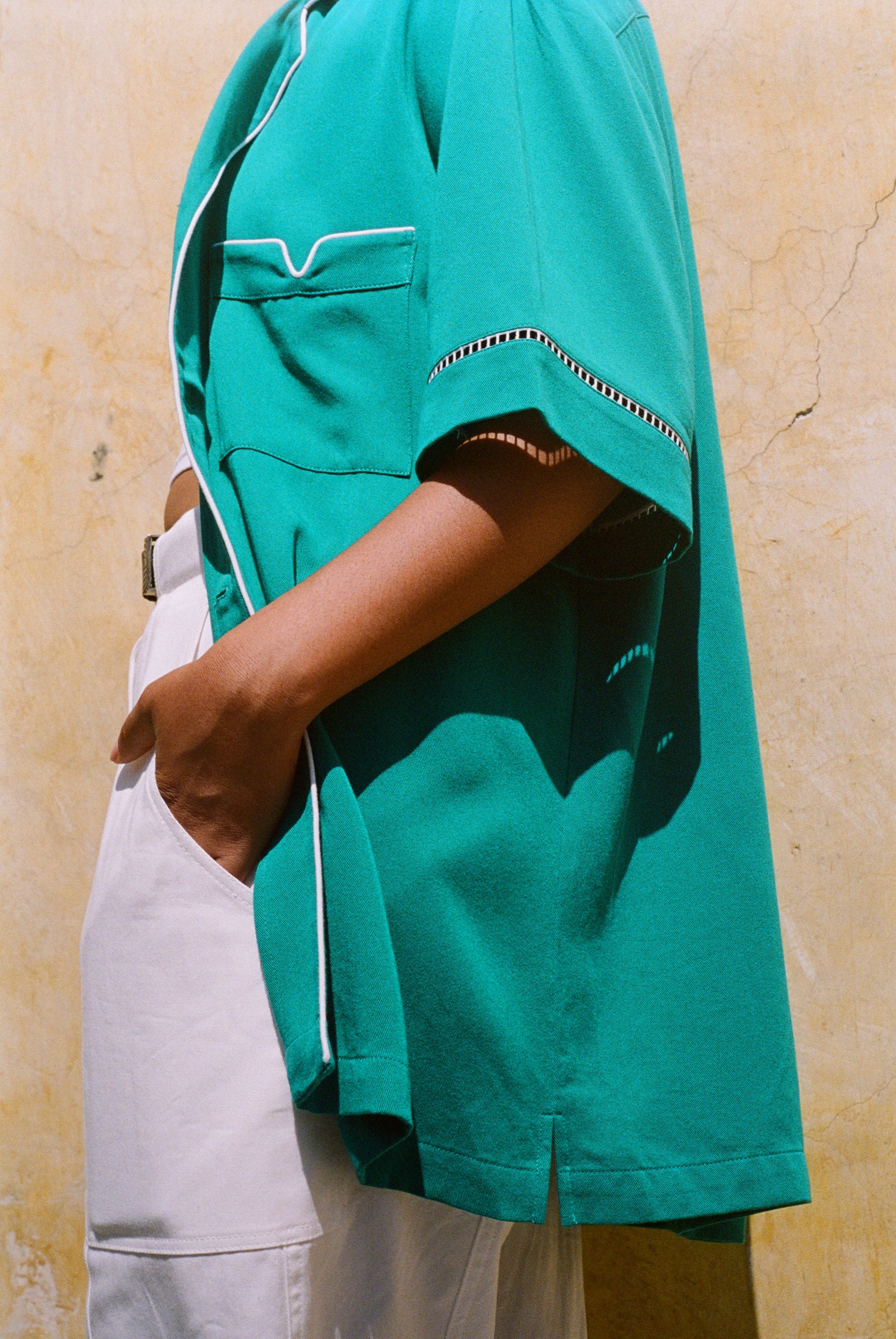 Side view of teal cabrisa showing white accents