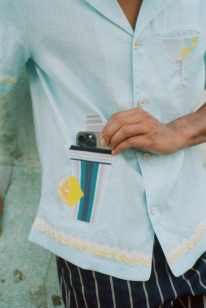 Man pulling iPhone out of bottom cocktail shaker pocket