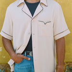 male model wearing his cabrisa with one button buttoned