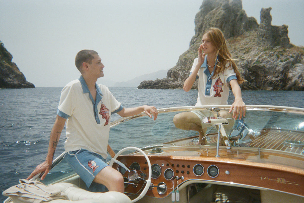 male and female models on boat both wearing the matching set