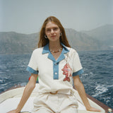 Female model wearing pop over on a boat