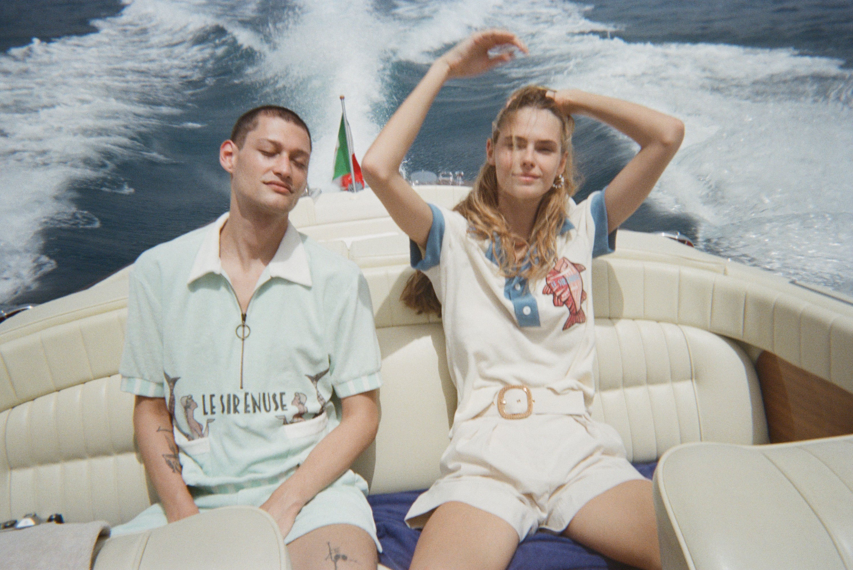 Female model in pop over next to male model in le sirenuse set