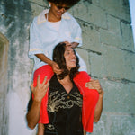 Model wearing Big Brut Cabana carrying a woman on his shoulders