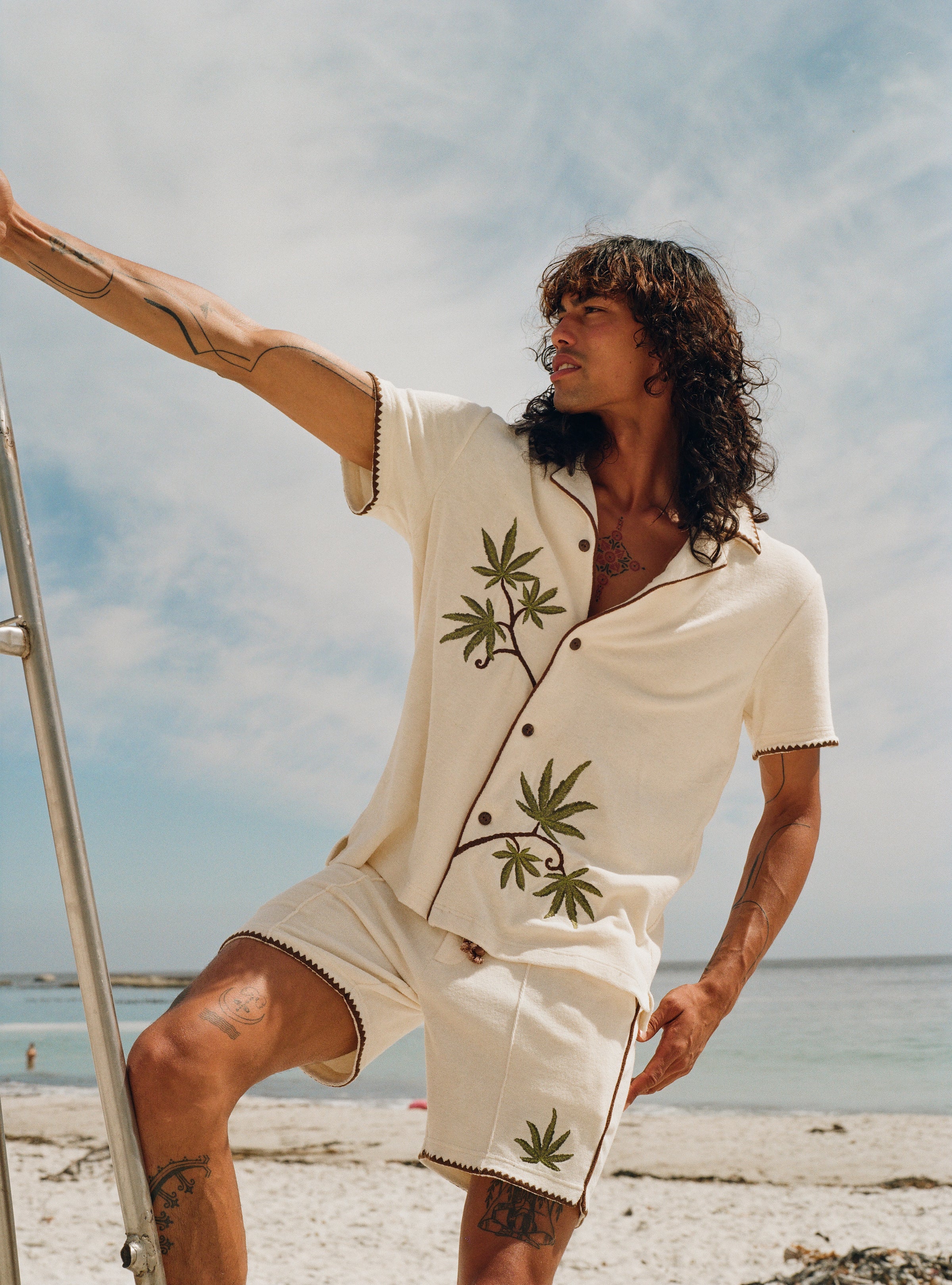 Man leans against lifeguard chair