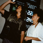 Man wearing Big Brut shirt drinking straight out of champagne bottle