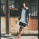 man leans away from pole