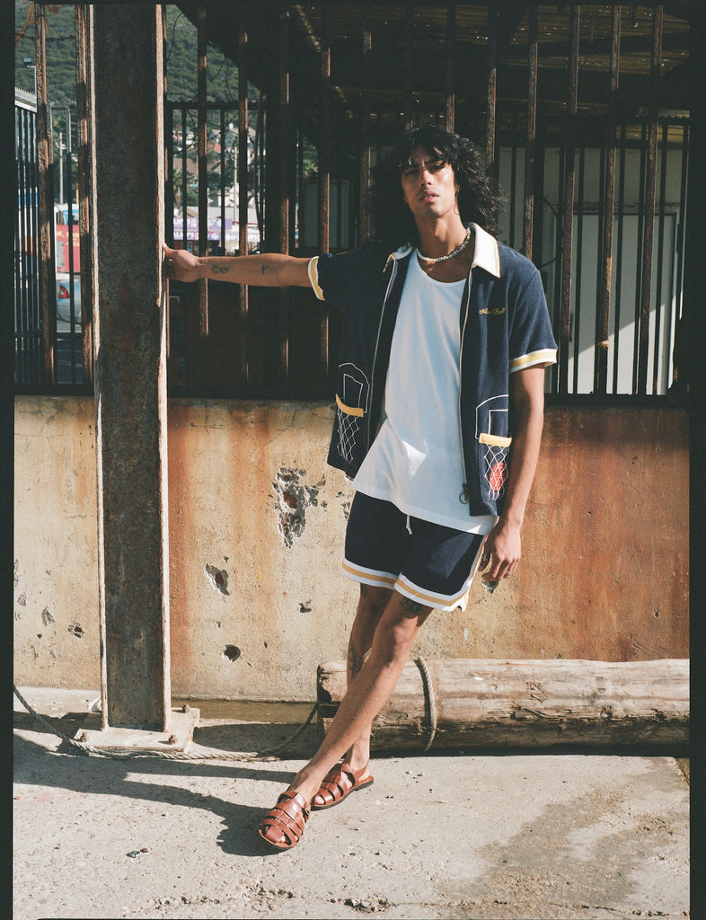 man leans away from pole