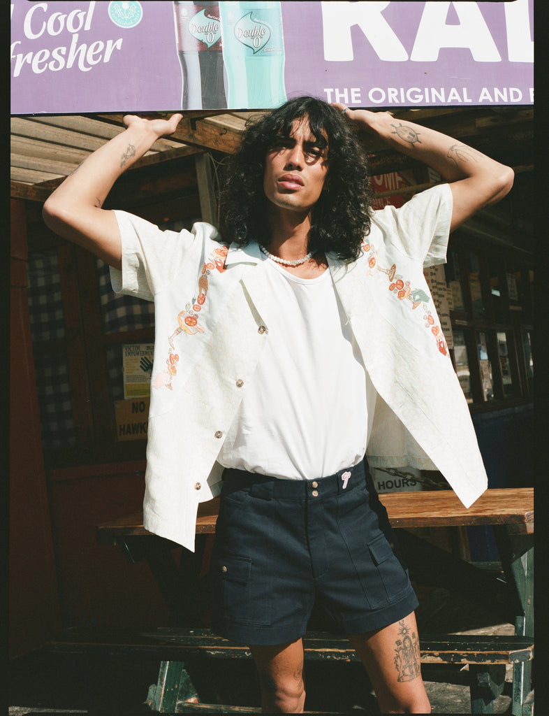man holds sign above his head
