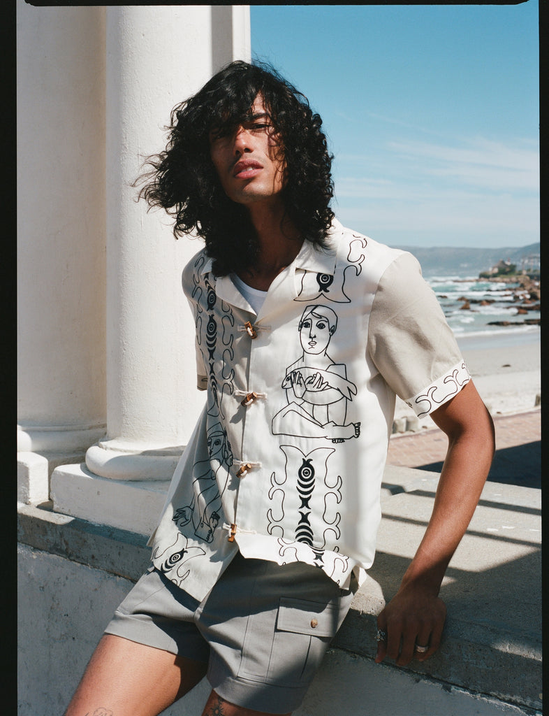 man sits and stares at camera