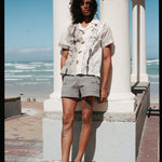 man leans against pillar