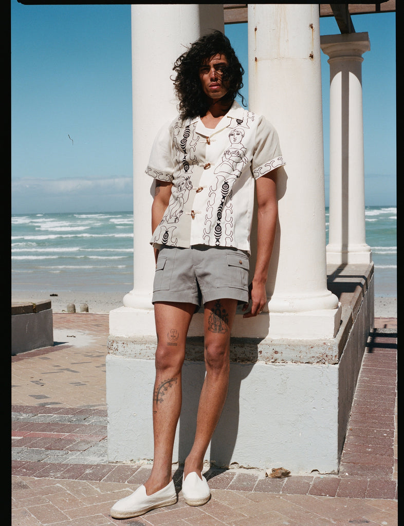 man leans against pillar