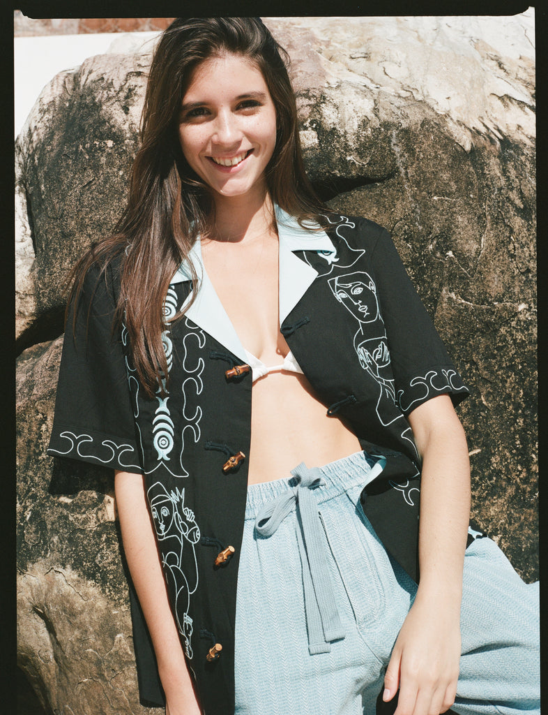 Marie de Buttet jet black shirt with woman smiling