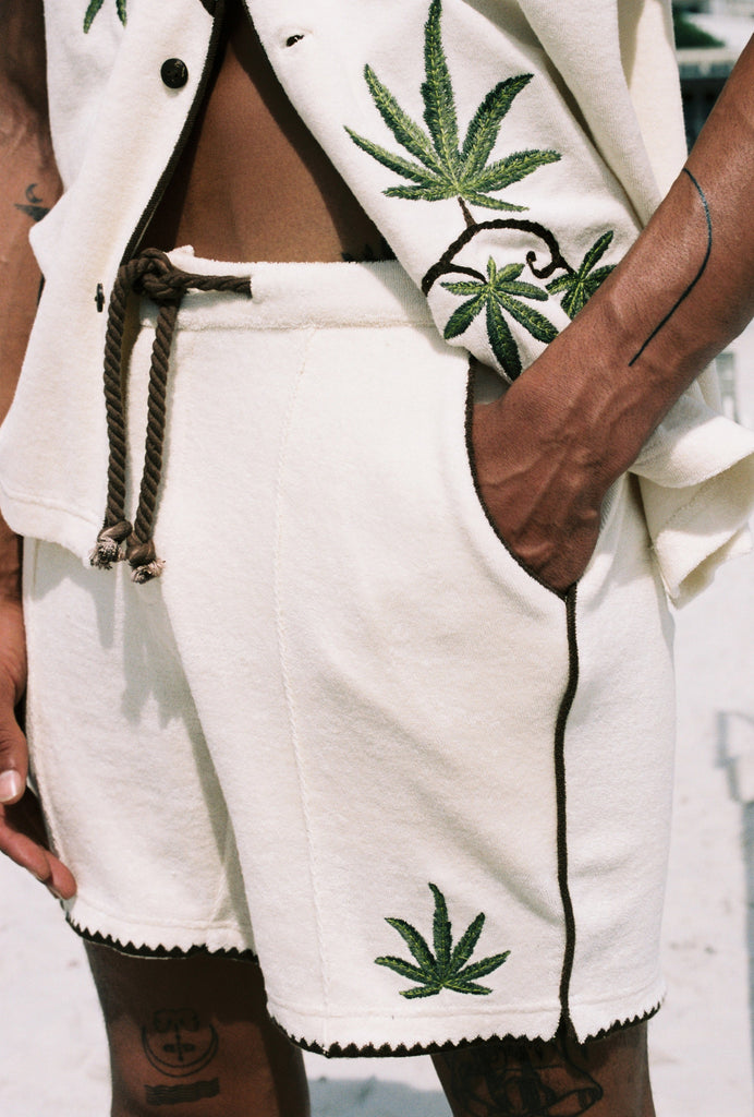 man puts hand in pocket with close up of torso