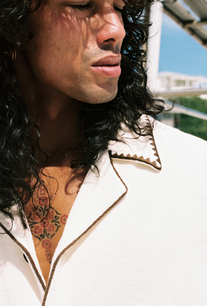 close up of mans face and collar of shirt