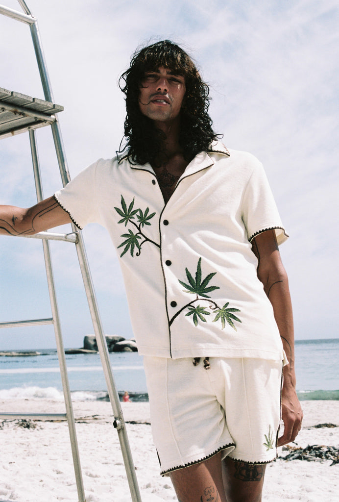 man looks at camera wearing full matching set