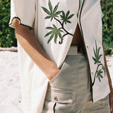 woman wears shirt with one button closed