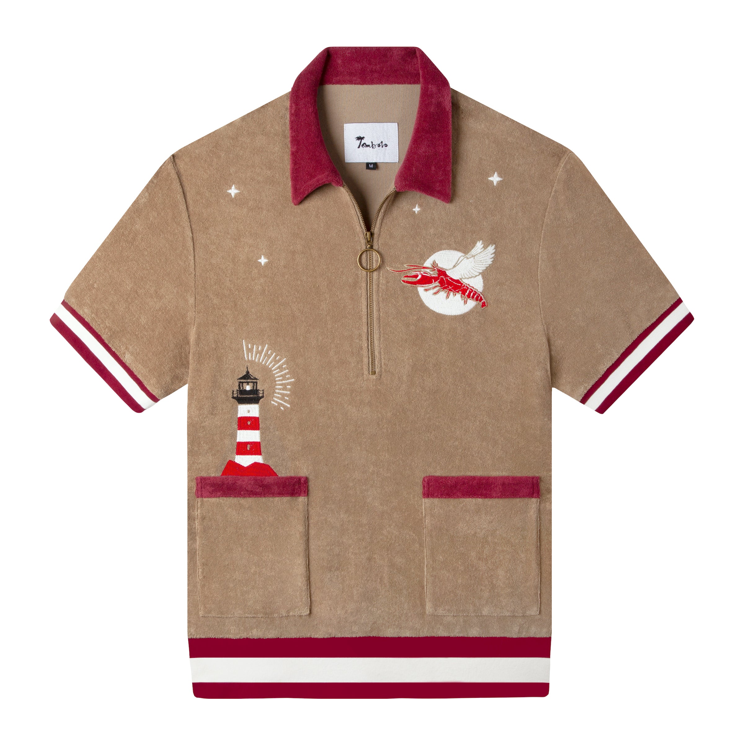 Embroidered with lighthouse emerging from the pocket and a flying lobster eclipsing the moon in a starry night.