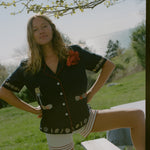 Female model wearing the crop cut vongole top