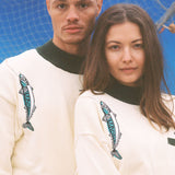 Male and female models both wearing the sweater