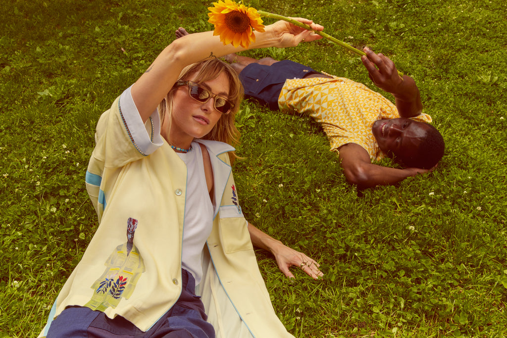 Models lying in field wearing wole shirts
