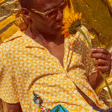 Man smells sunflower