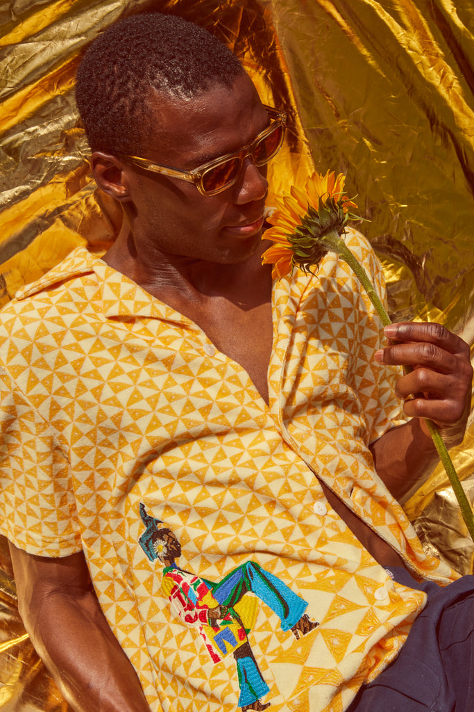 Man smells sunflower