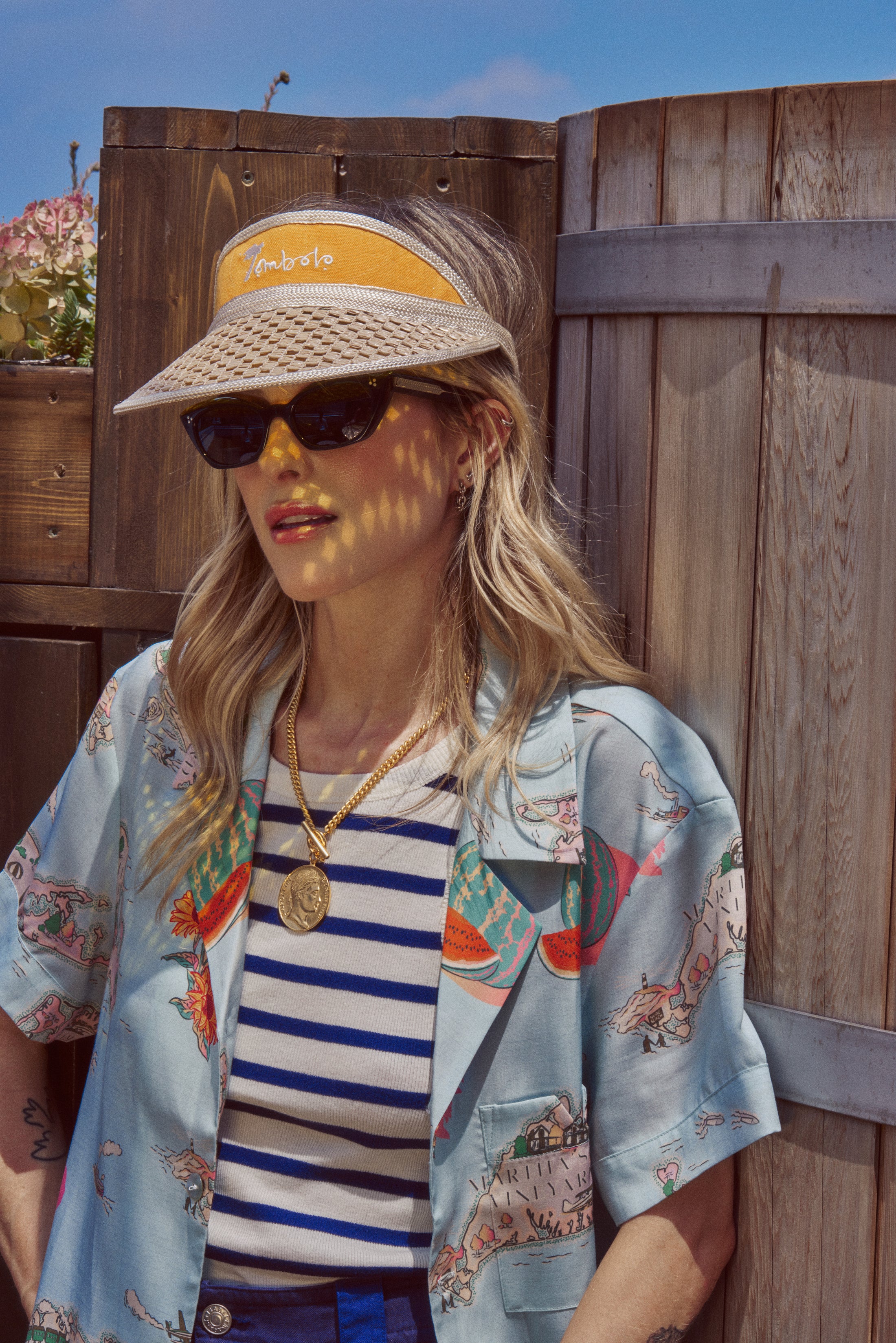 Female model wearing the top paired with the yellow tombolo visor