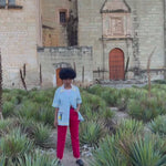 Video of woman wearing oversized Tombolo linen martini shirt walking happily towards camera