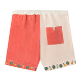 Back view of our Gusanito shorts showcasing a salmon pocket with white piping on the right side pocket 