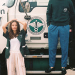 Man stands on step with woman beneath him