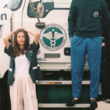 Man stands on step with woman beneath him