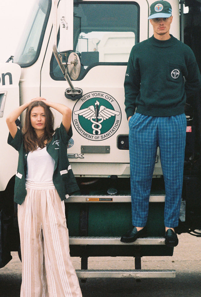 Man stands on step with woman beneath him
