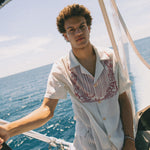 Male model wearing top on boat