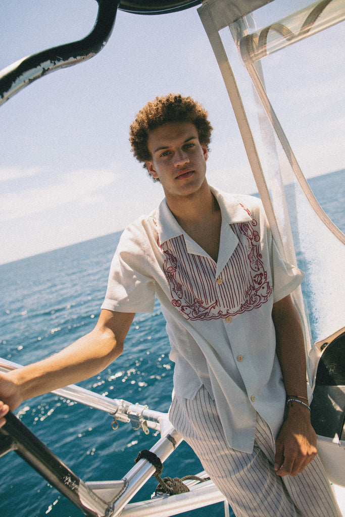 Male model wearing top on boat