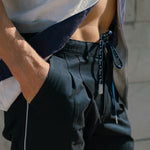 Male model wearing the pants tied 