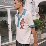 Male model wearing pop over with navy easy going pants 