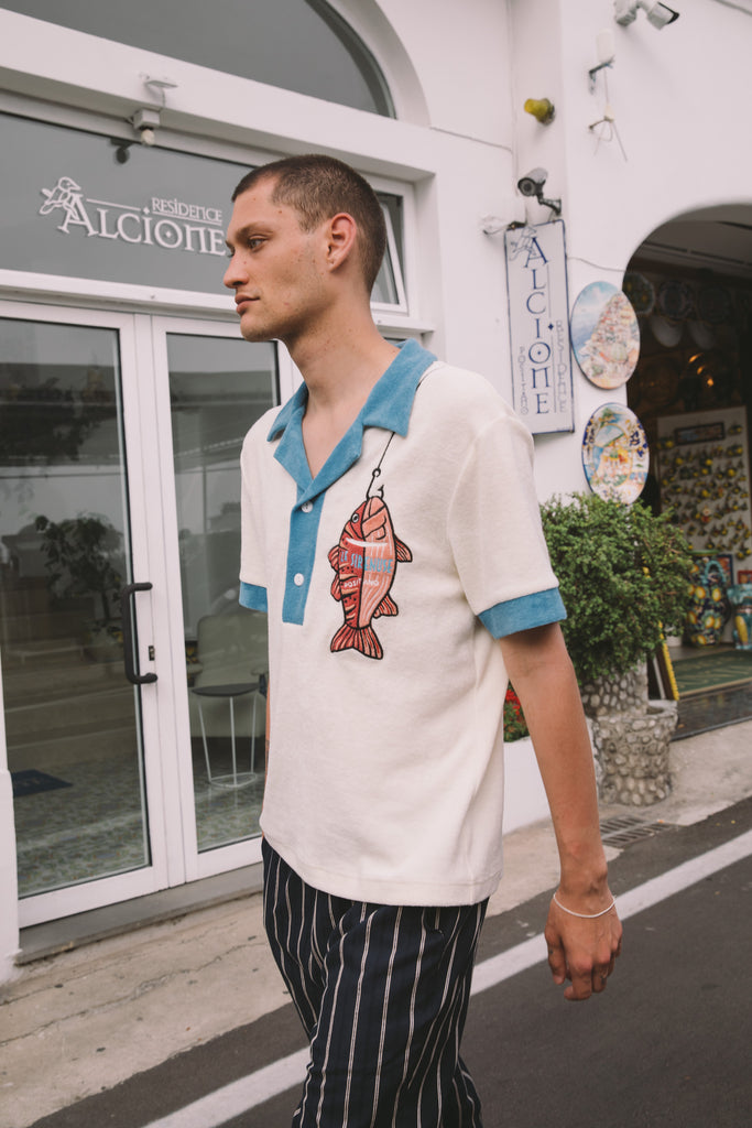 Male model wearing pop over with navy easy going pants 